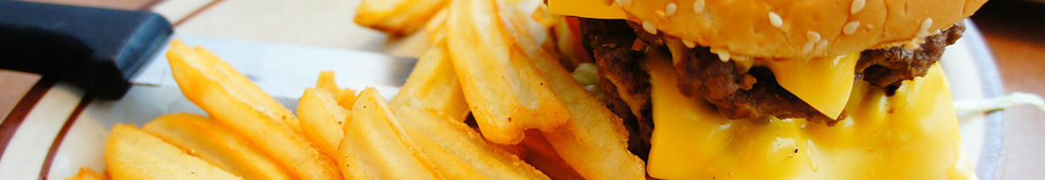 Eating American (Traditional) Burger Seafood at Spanky's Beachside restaurant in Tybee Island, GA.